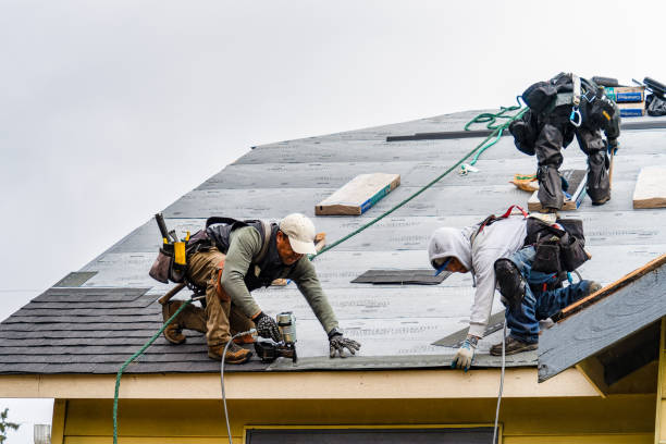 Professional Gutter Installation technician working in Dorchester, MA
